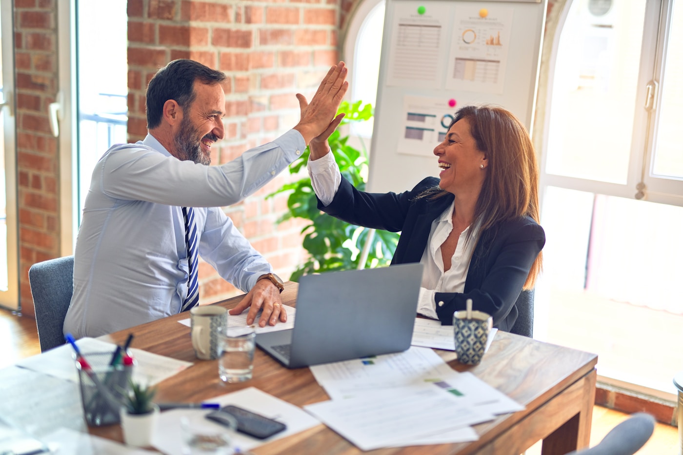 Facilitator reviewing audit-ready AI output with a learner