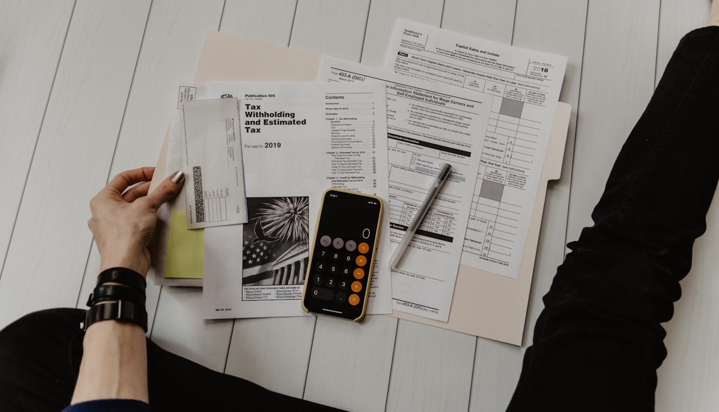 Professional reviewing expense and invoice documents with AI-assisted workflows